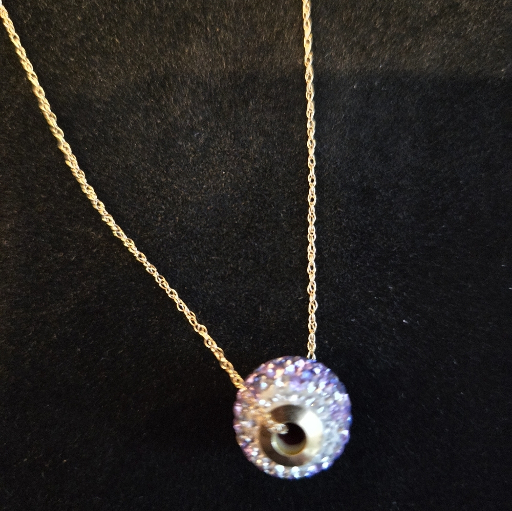Necklace has a Purple, Pink & White CZs on Charm On a Goldtone Chain